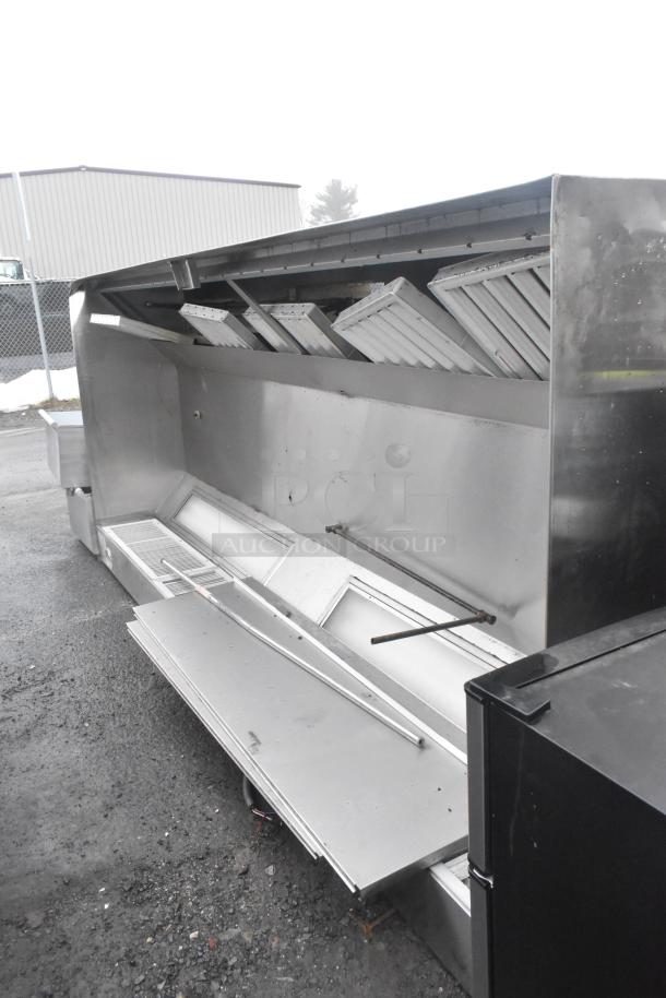 11' Ventroguard commercial return air grease hood with filters, stainless steel, used, clean condition, industrial setting.