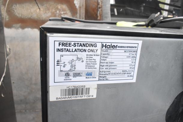 Haier HC17SW20RB mini cooler label showing model, capacity 1.7 cu. ft., voltage 115V, installation only tag.