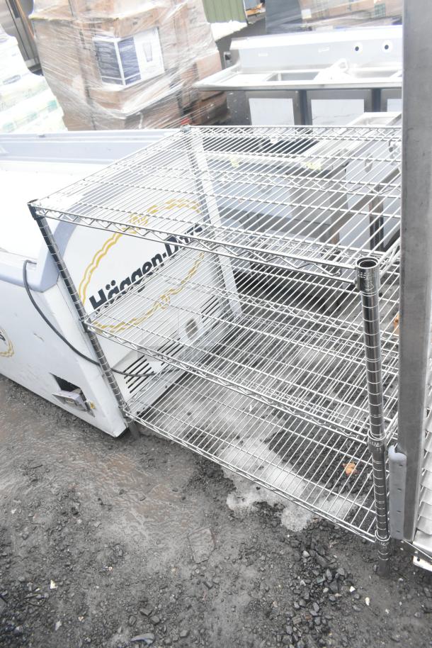 Chrome finish 3-tier wire shelving unit, sturdy frame, in used condition. Buyer must dismantle. Consider freight charges.