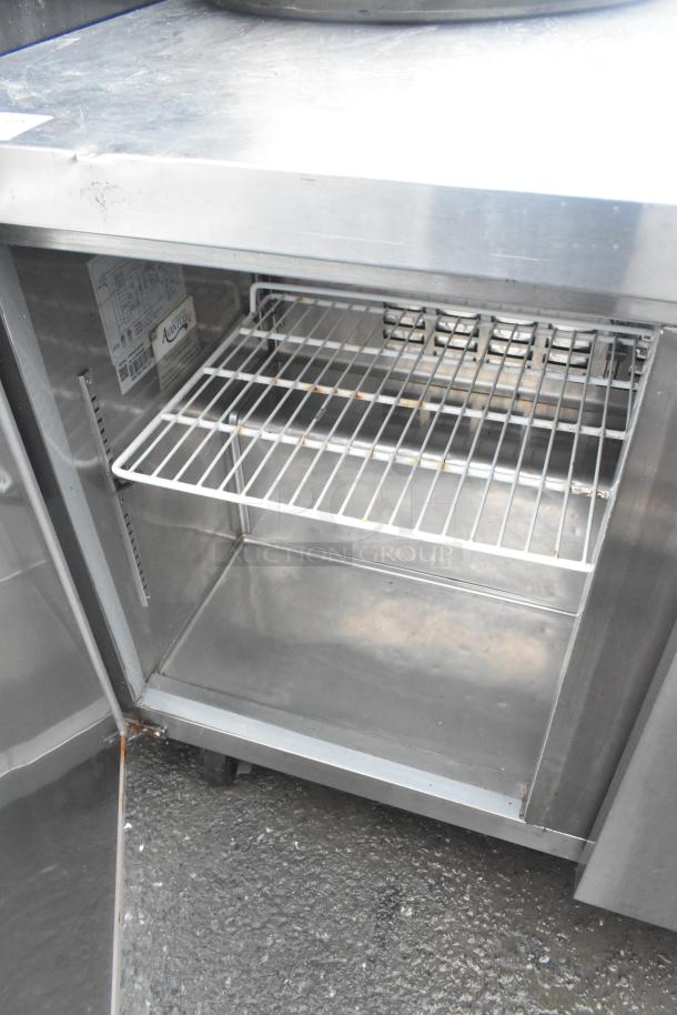 Avantco 178SSUC48FHC commercial freezer, 2-door, on casters. Stainless steel, 115 volts, excellent condition, interior view.