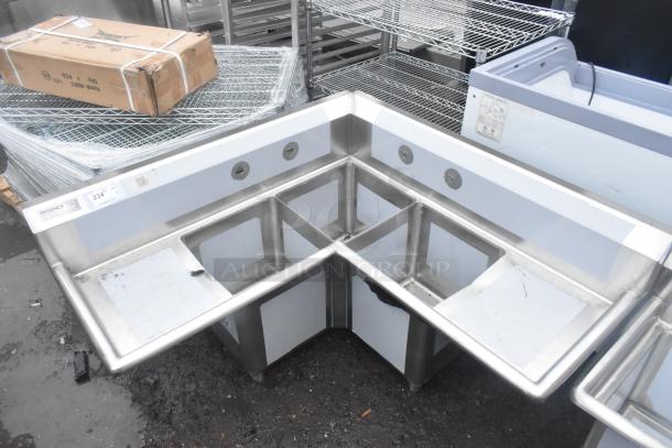BRAND NEW Regency 600S3141414C stainless steel three-compartment corner sink, 16 gauge, two drainboards, no legs, scratch and dent condition.