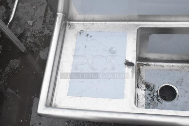 "Regency stainless steel corner sink, three compartments, two drainboards, 16-gauge, scratch and dent, no legs."