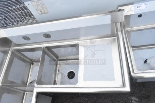 Regency 600S3141414C 16 gauge stainless steel 3-compartment corner sink with two drainboards, scratch and dent, no legs.