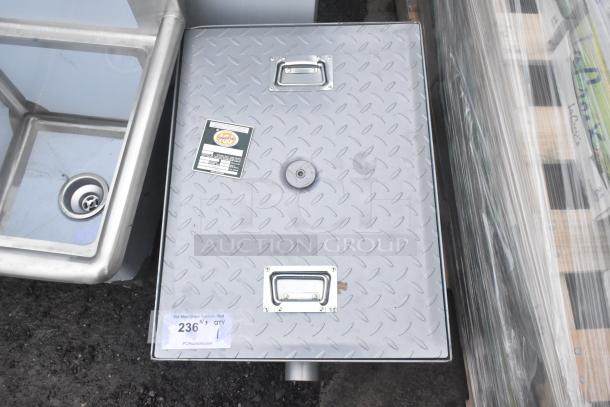 Brand new Regency 600GT15 30 lb. 15 GPM grease trap, PDI certified, with non-threaded connections, labels show specs.