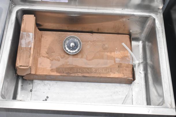 Brand new Regency 18"x24" underbar ice bin with 7-circuit post-mix cold plate, bottle holders, and minor dents.