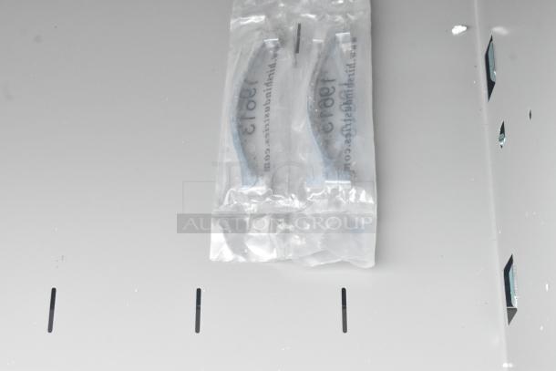 Brand new black 2-drawer filing cabinet, scratch and dent condition, handles packaged in plastic.