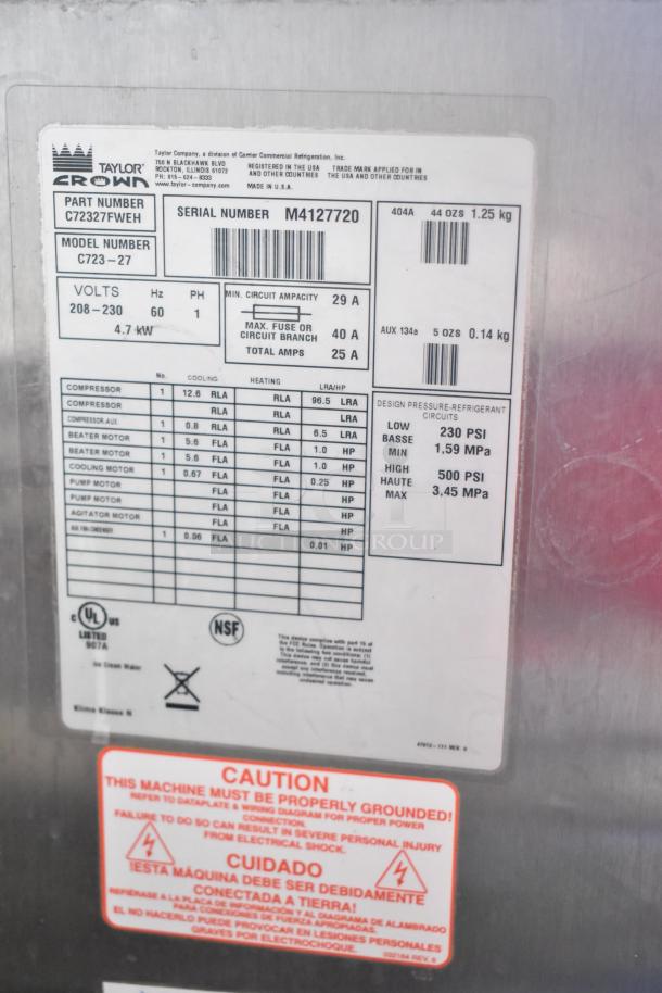 Taylor C723-27 stainless steel 2-flavor twist soft serve machine, 208-230V, 1 phase, with caution and specifications labels.