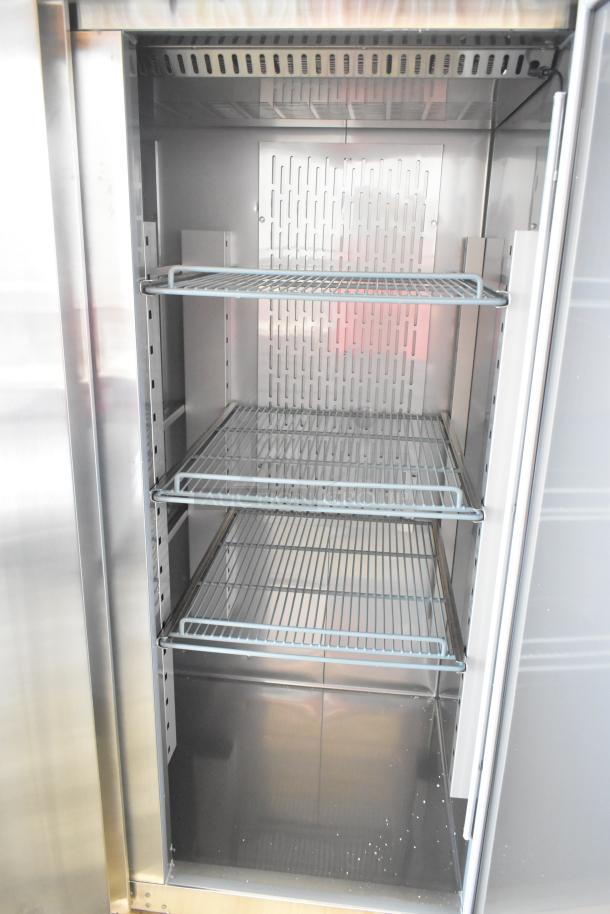 Brand new Avantco 178Z2FHC 2023 commercial freezer, 2-door, 115V, 1 Phase. Scratch and dent, wire shelves visible.