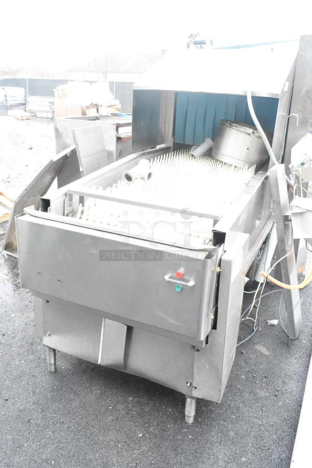 Hobart FT900 commercial flight style dishwasher, stainless steel, 480 volts, 3 phase, fair condition, visible buttons and parts.