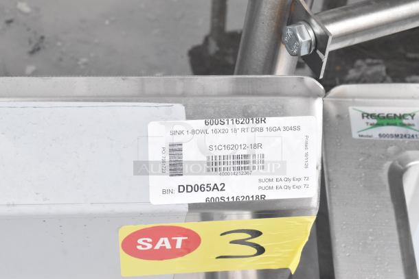 BRAND NEW Regency 600S1162018R single bay sink with right side drain board, no legs, scratch and dent, model tags visible.