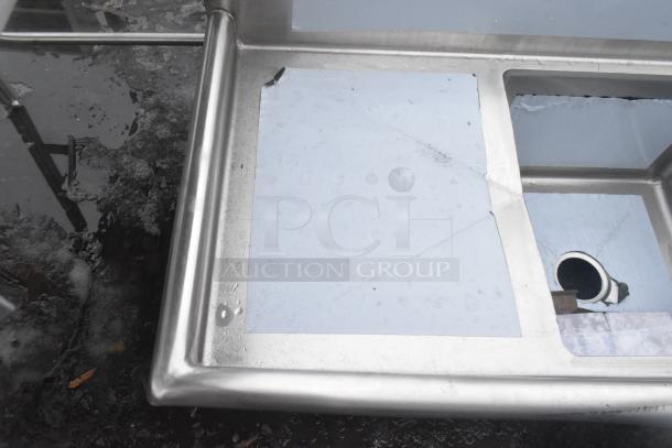 BRAND NEW Advance Tabco FE-3-1812-18RL stainless steel sink, three compartments, two drainboards, slight scratches.