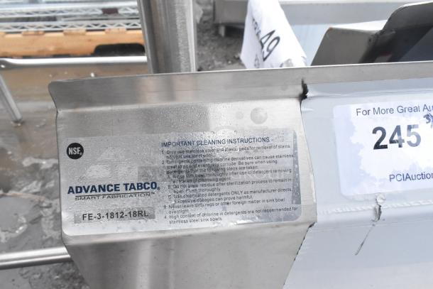 Advance Tabco FE-3-1812-18RL sink, stainless steel, new condition, minor scratches, cleaning instructions visible.