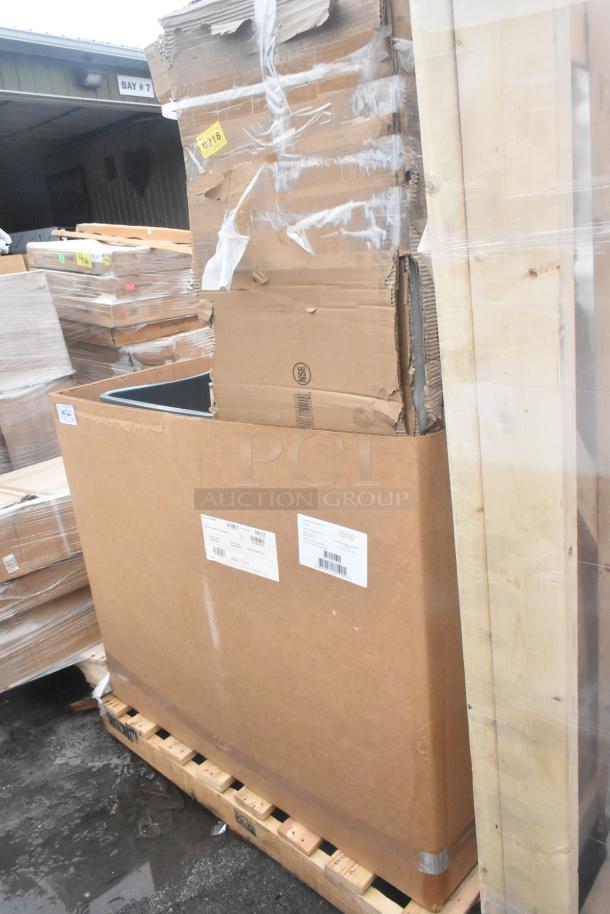 Pallet with new scratch-and-dent items, including gray trash cans and a sink, in original packaging. Labels indicate NSF certification.