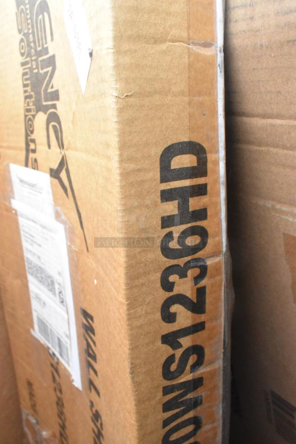 Cardboard box with "WALL-SHELF 1236HD" marking, indicating contents of 14 new scratch and dent items, including gray trash cans and more.