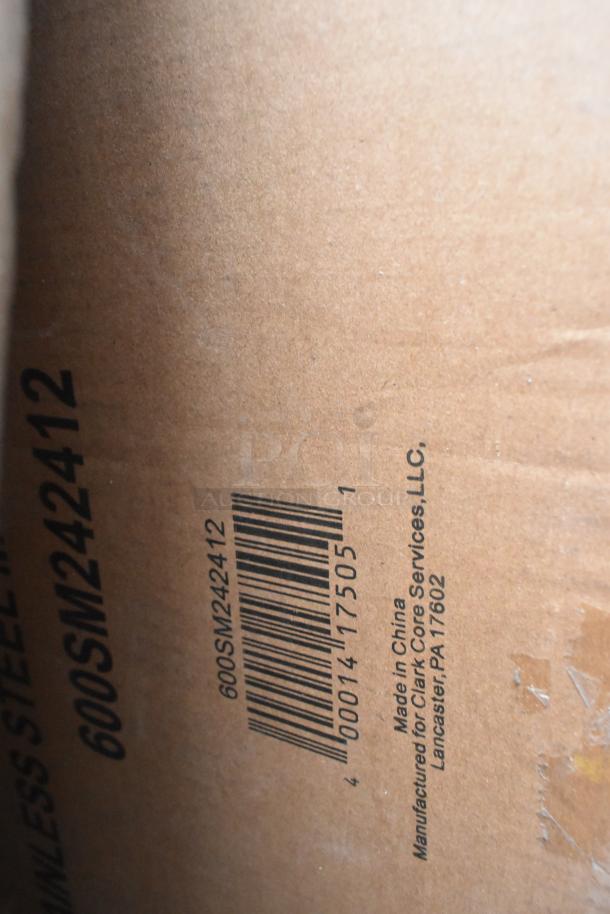 Cardboard box with barcode 600SM242412, marked "Made in China" for Clark Core Services, Lancaster, PA 17602.