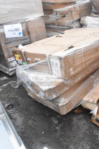 Four boxed, scratch and dent items: work table and bi-fold tables, wrapped in clear plastic. Various labels and tags visible.