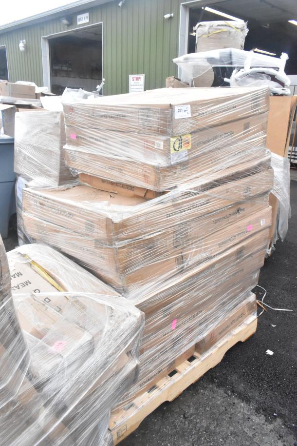 Shrink-wrapped pallet of 14 brand new, scratch and dent outdoor tables. Boxes display item numbers and are stacked neatly.