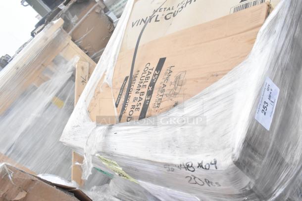 18 new scratch and dent items including Lancaster table base columns, pallet wrapped, labeled with specs and quantities.