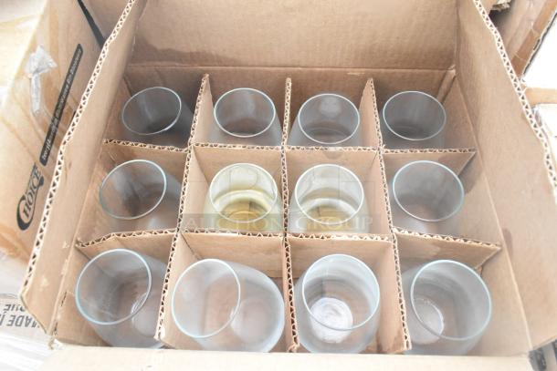 Box of assorted glassware in cardboard dividers, part of a 40-item scratch and dent auction package.