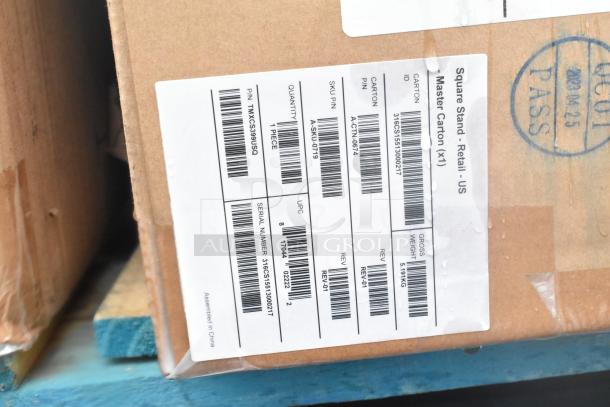 Cardboard box with shipping label showing item codes, quantity, and gross weight. Contains new scratch and dent kitchenware.