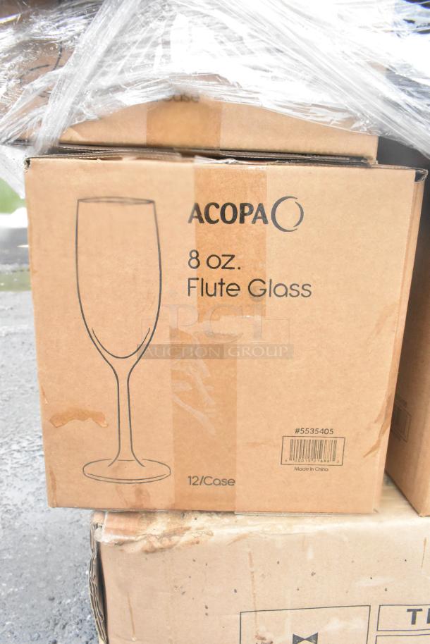 Box of Acopa 8 oz. flute glasses, 12 per case, labeled #5535405. Packaged in shrink wrap. Scratch and dent condition.