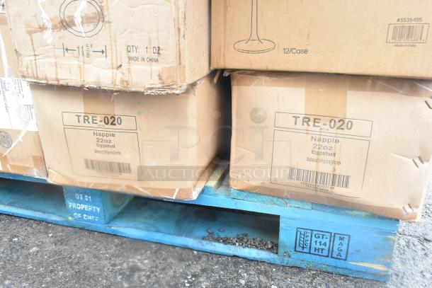Boxes on a blue pallet containing 22oz Nappie Eggshell dishes, marked as 36 pieces per carton. Brand: TRE-020.