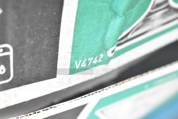 Close-up of a box corner marked with "V4742," containing 40 new scratch and dent items like plates, glassware, ramekins.