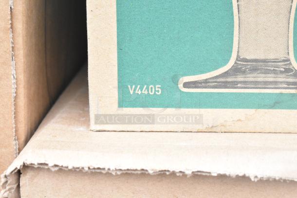 Cardboard box corner with product code "V4405" visible, part of a scratch and dent auction set.