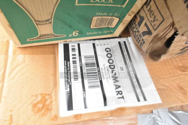 Cardboard boxes labeled "Made in Spain" with a visible GoodSmart label containing a barcode and product details.