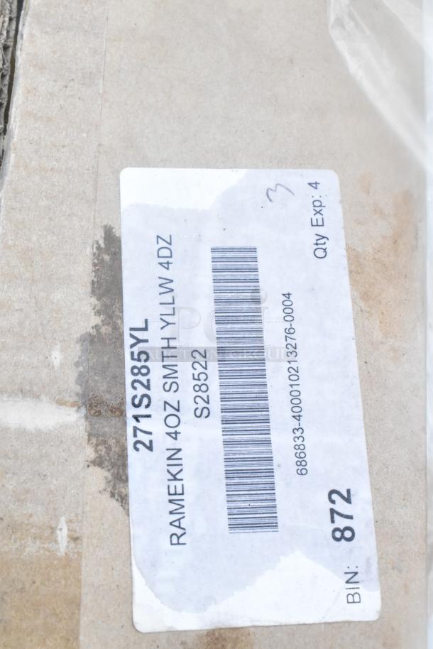 Label on box indicating contents as 4oz yellow smooth ramekins, model S28522, with barcode and BIN number 872.