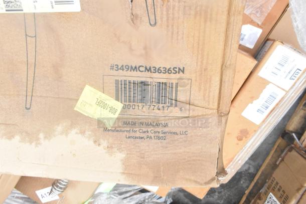 Cardboard box with barcode and model #349MCM3636SN, labeled "Made in Malaysia" for Clark Core Services. Box appears worn.
