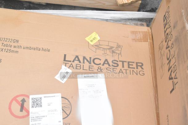 Cardboard box labeled "Lancaster Table & Seating", contains outdoor table with umbrella hole, SKU TL373232GN, brand new condition.