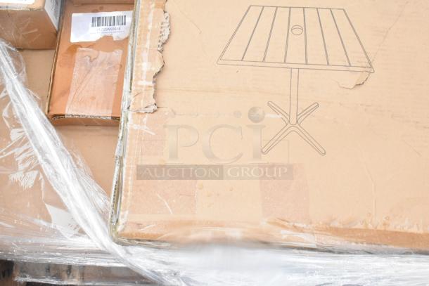 19 brand new scratch and dent items, including cardboard boxes of wall corner guards and outdoor tables, wrapped in plastic.