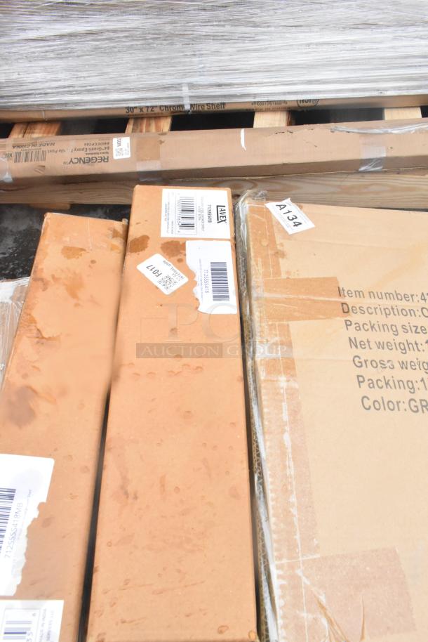 Boxes containing new scratch and dent items, including wall corner guards and shelves. Visible labels show item details and barcodes.