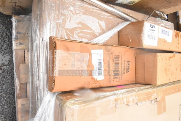 Multiple boxed items including Lavex stainless steel wall shelf with visible labels; some packaging shows wear.