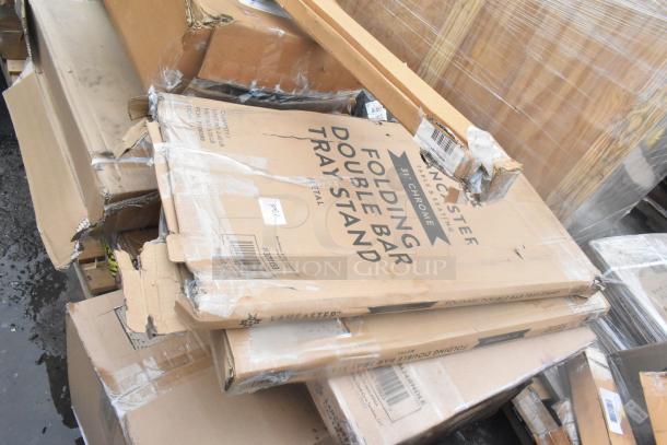 24 scratch and dent items, including Lancaster chrome tray stands in original packaging; some box damage visible.