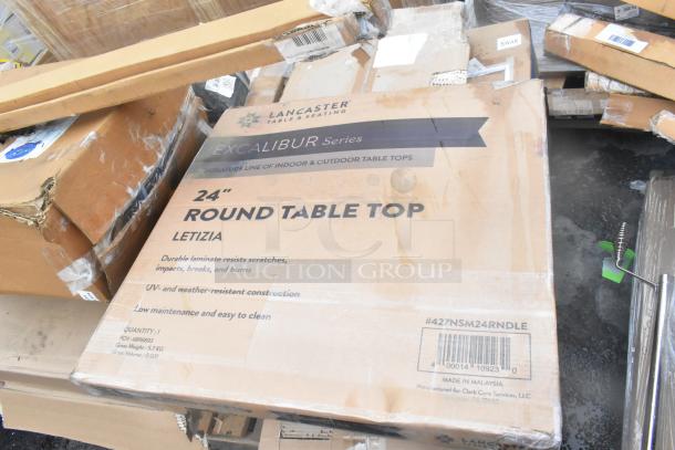 Box of Lancaster Table & Seating 24" round table tops with durable laminate, UV-resistant construction. New condition.