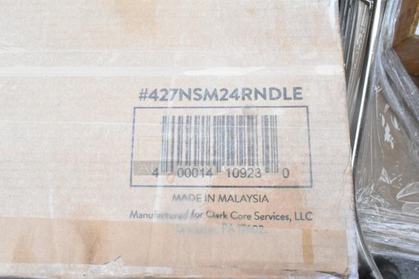 Cardboard box with barcode #427NSM24RNDLE, marked "Made in Malaysia" by Clark Core Services, LLC. Contains 24 new scratch and dent items.