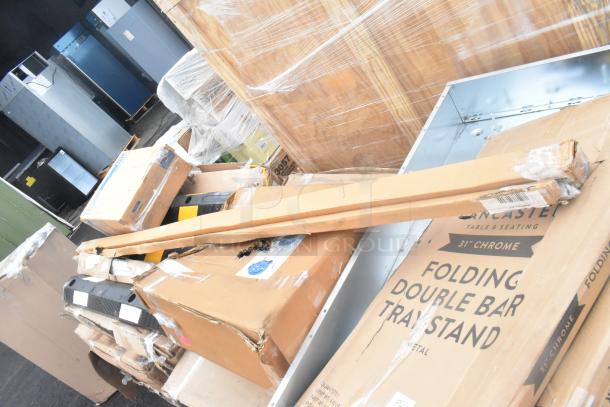 24 new scratch and dent items including wall corner guard, work table, and tray stand. Visible boxes vary in size and labeling.