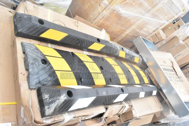 24 new scratch and dent items including corner guard, work table, and tray stand. Mixed materials, some with yellow and black safety markings.