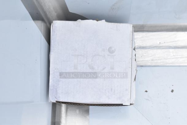 Brand new Regency 600SM242412C corner mop sink, 16-gauge stainless steel, 24"x24"x12" bowl, notched front. Minor dents.