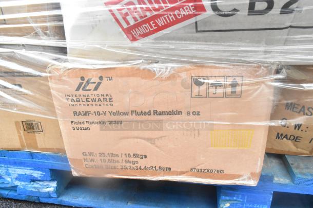 Box labeled "ITI International Tableware" containing RAMF-10-Y Yellow Fluted Ramekins, 8 oz, 3 dozen, on blue pallet.