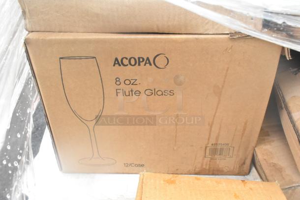 Box of Acopa 8 oz. flute glasses, 12 per case, brand new scratch and dent, visible markings indicating item details.