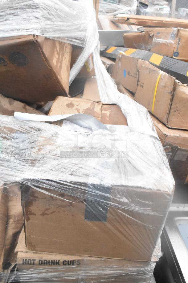 Boxes of brand new scratch and dent items, wrapped in plastic. Contains glassware and dishes. Labeled "Hot Drink Cups."