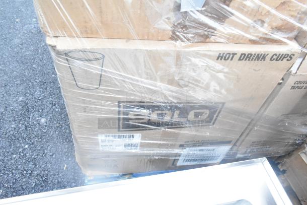 Cardboard box labeled "SOLO Hot Drink Cups," wrapped in plastic, part of a lot of 34 scratch and dent items.