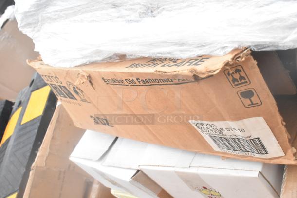 Damaged box labeled "Excalibur Old Fashioned" containing 34 new scratch and dent items, including glassware and dishes.