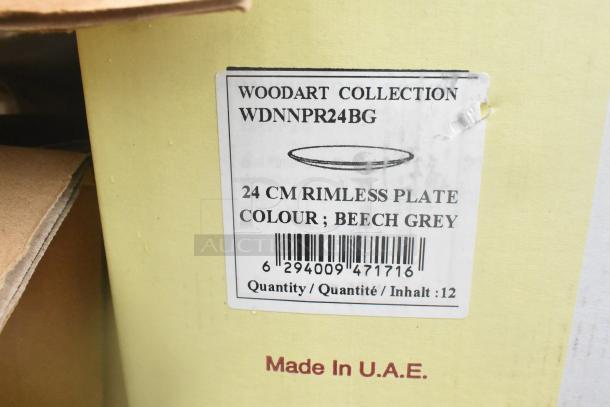 Label on box of Woodart Collection rimless plates, 24 cm, beech grey, quantity of 12, made in UAE, barcode visible.