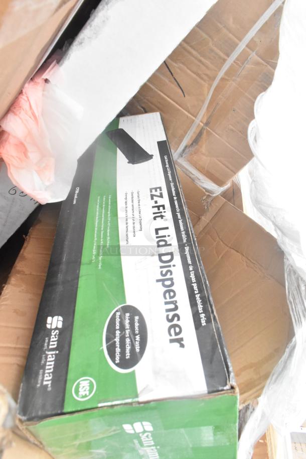 San Jamar EZ-Fit Lid Dispenser box in cardboard packaging, scratch and dent condition.