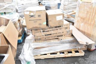 Boxes of 12 new scratch and dent items including wire shelves, dump sink, tray stands, stacked on a pallet.