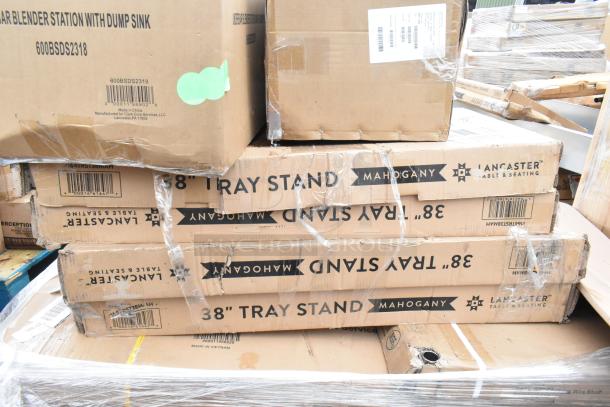 12 new scratch and dent items, including wire shelves, dump sink, and tray stands in boxes. Visible labels show product details.